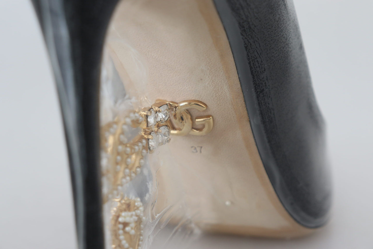 Dolce & Gabbana Schwarze Pumps aus Leder mit Kunststoffummantelung
