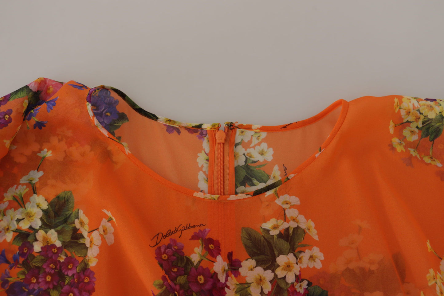 Dolce & Gabbana – Orangefarbene Bluse mit Blumenmuster und langen Ärmeln