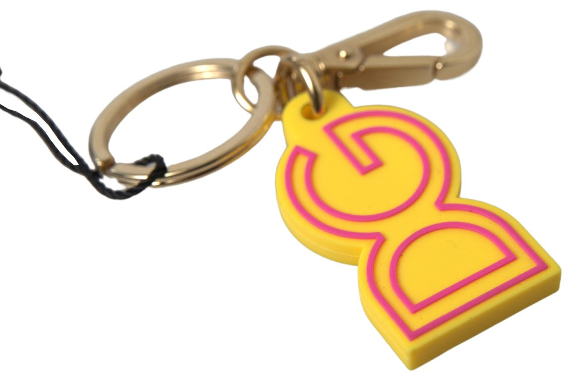 Dolce & Gabbana Schlüsselanhänger mit DG-Logo aus gelbem Gummi und goldenem Messing