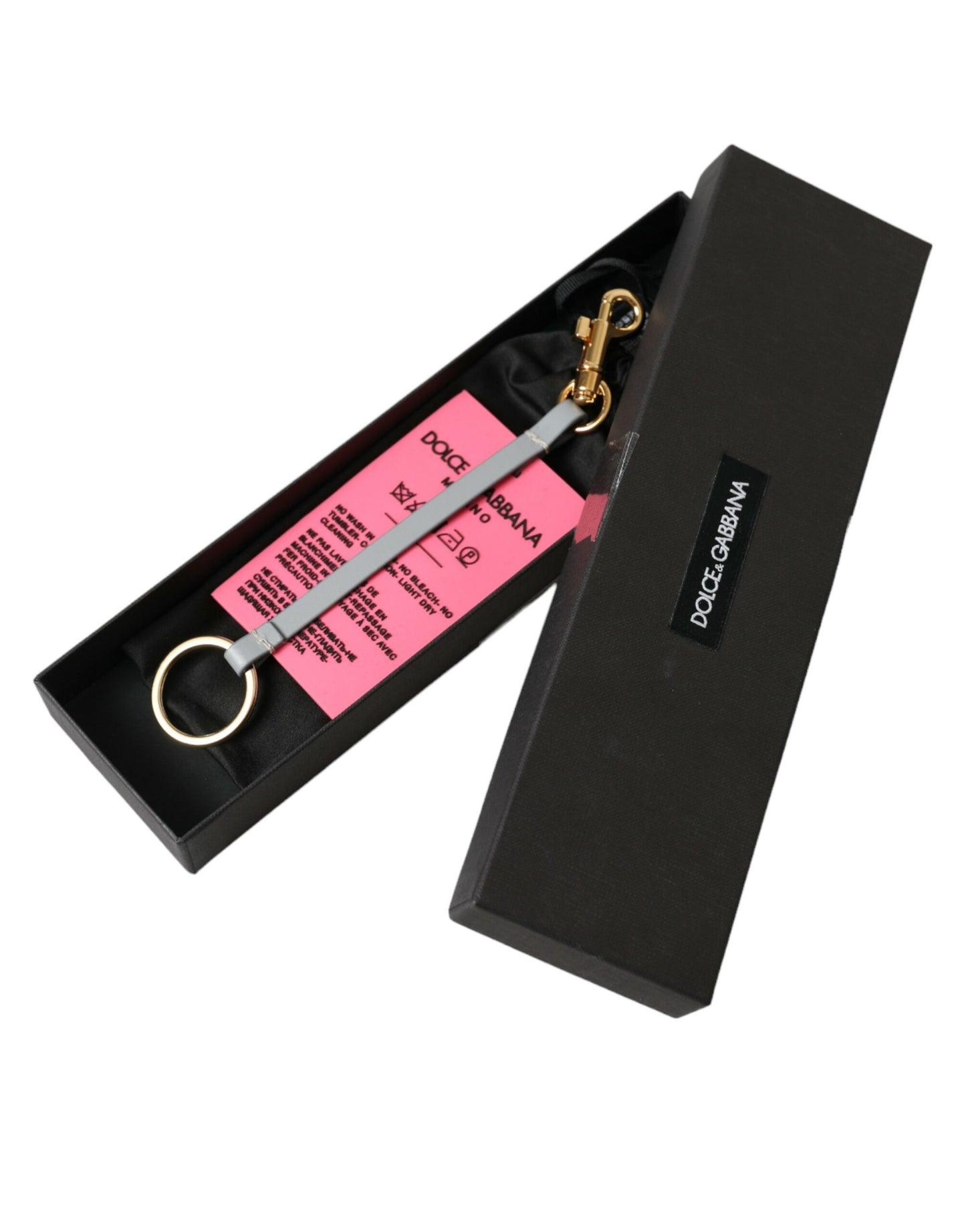 Dolce & Gabbana Schlüsselanhänger aus rosa Silikon mit DG-Logo und goldenem Messing