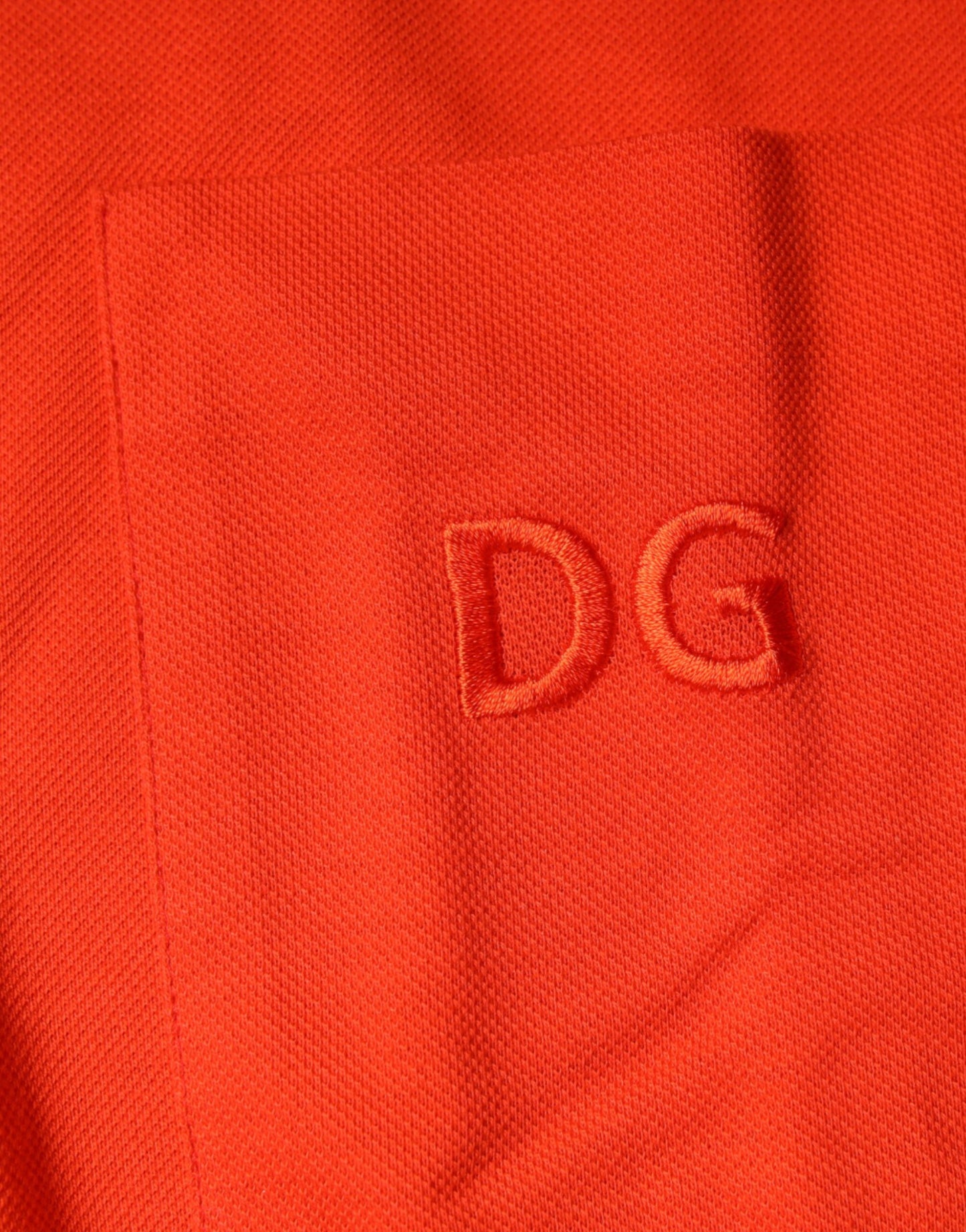 Dolce & Gabbana – Orangefarbenes, lässiges Poloshirt aus Baumwolle mit Knopfleiste