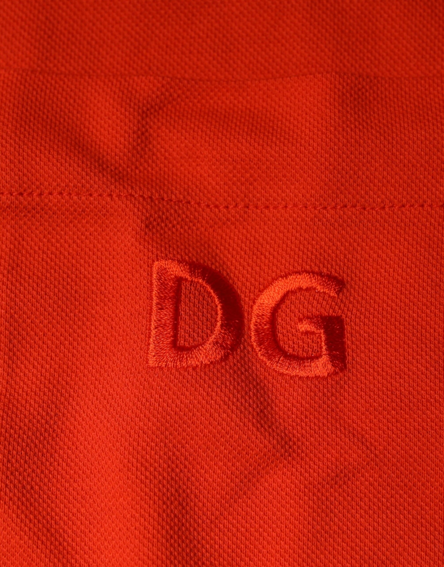 Dolce & Gabbana – Orangefarbenes, lässiges Poloshirt aus Baumwolle mit Knopfleiste