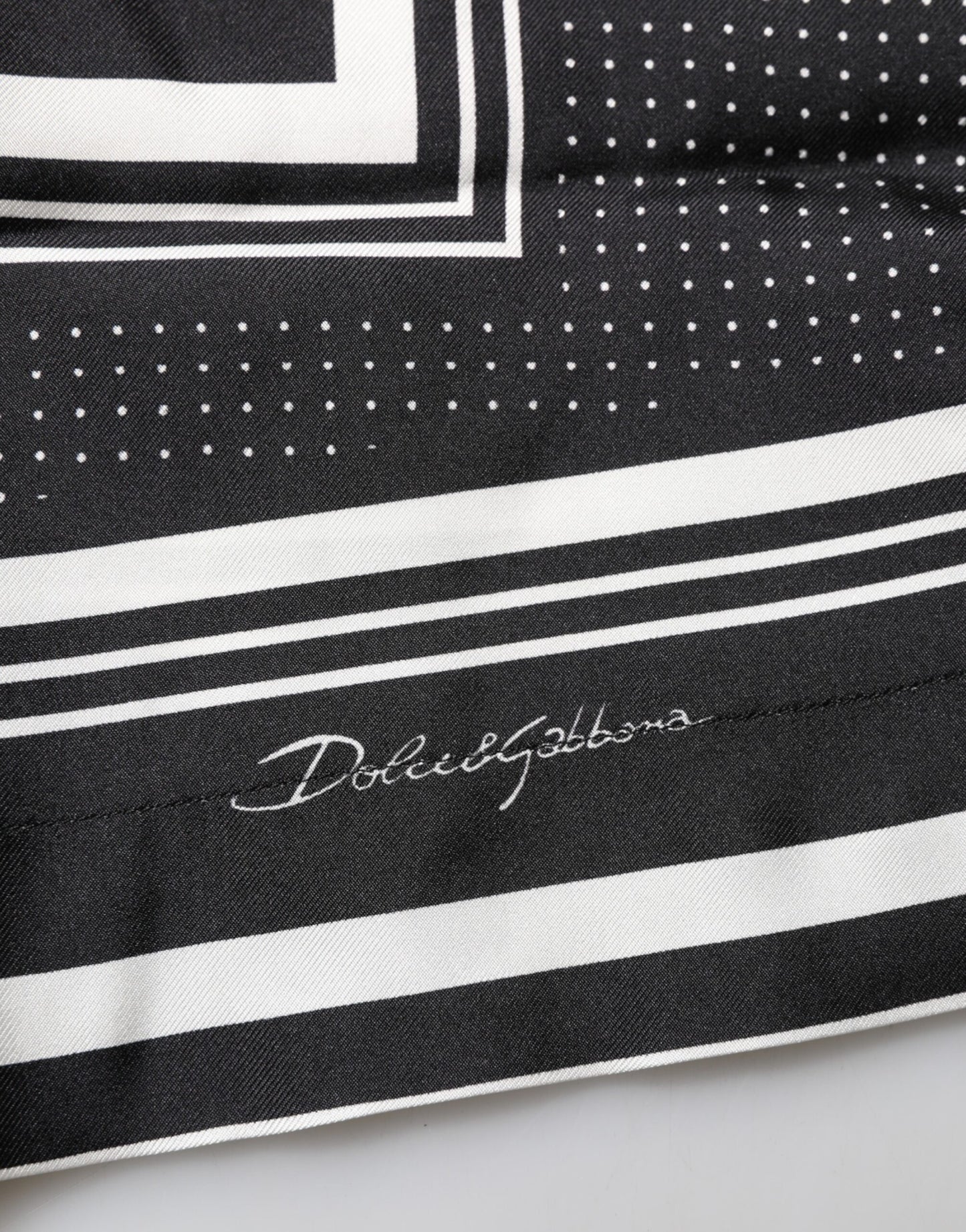 Dolce & Gabbana – Lässiges Poloshirt mit Streifen- und Punktmuster in Schwarz und Weiß