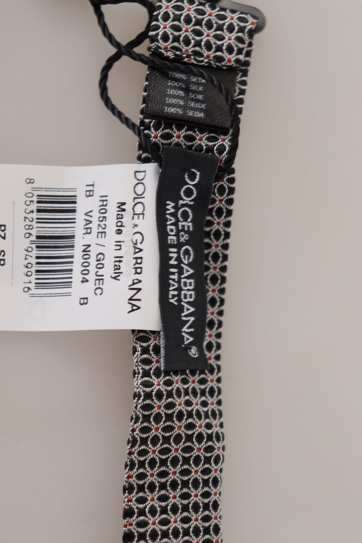 Dolce &amp; Gabbana – Schwarz-weiße Seidenkrawatte mit Blumenmuster und Papillon-Muster