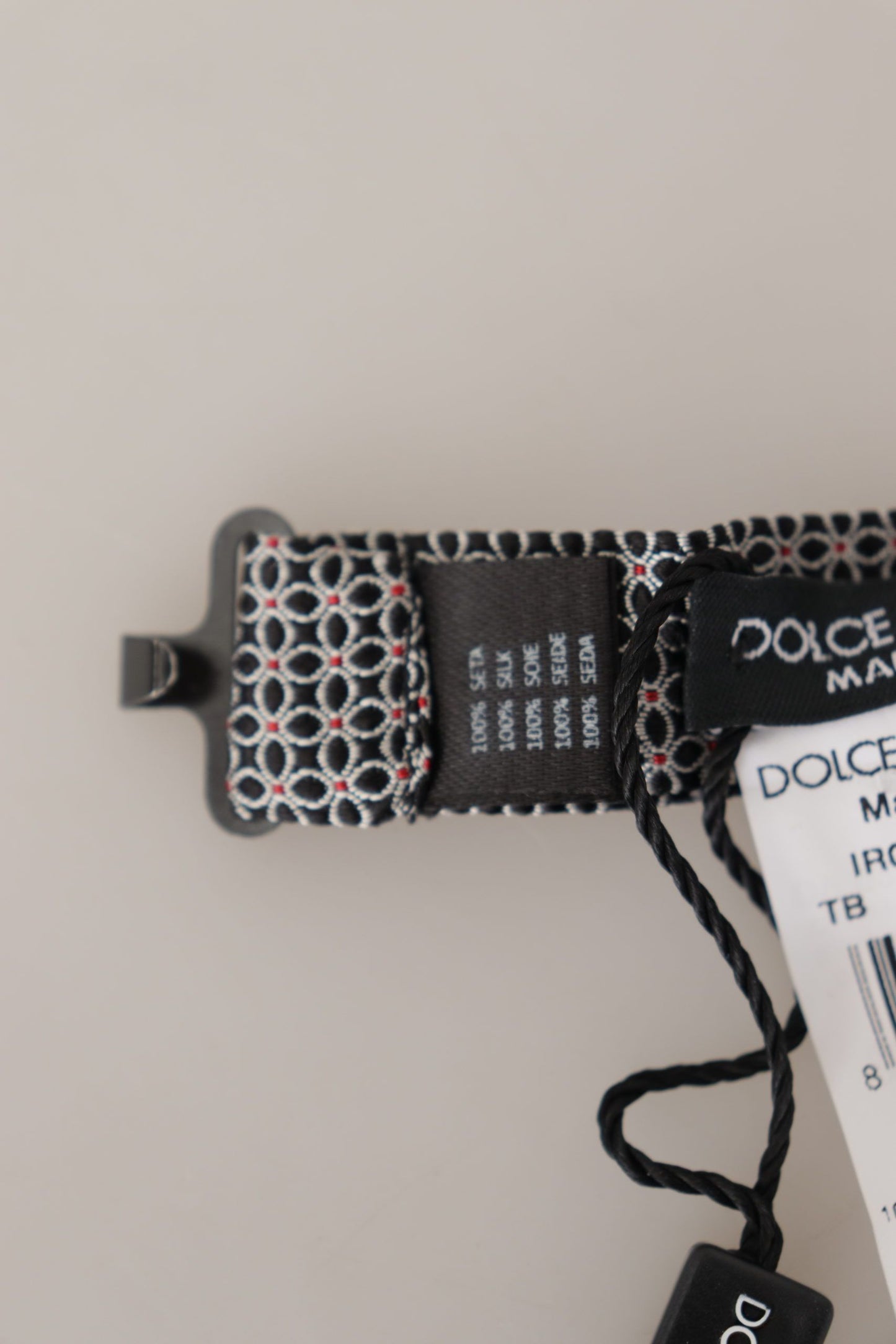 Dolce &amp; Gabbana – Schwarz-weiße Seidenkrawatte mit Blumenmuster und Papillon-Muster
