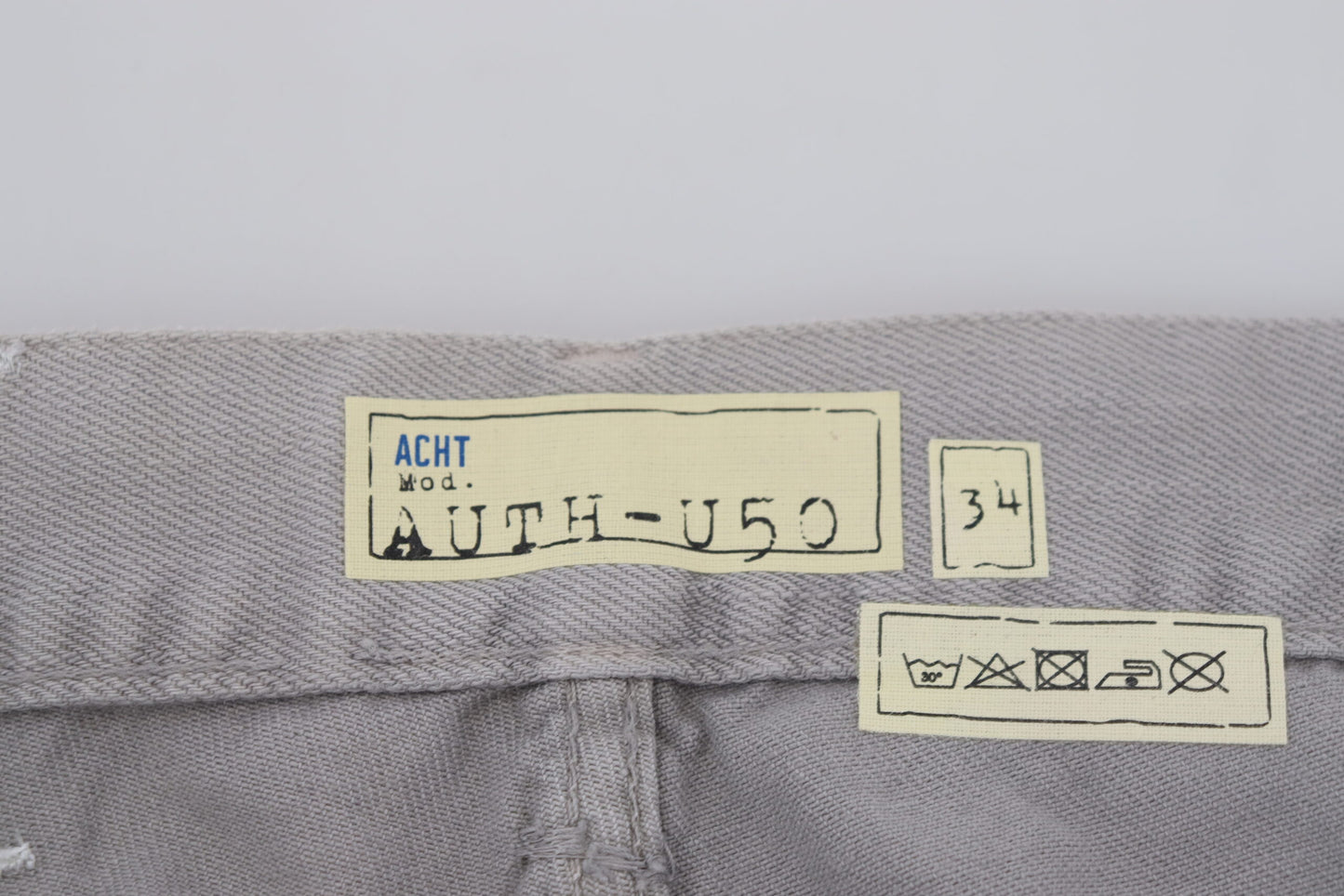 Acht – Lässige Jeans aus Baumwolle mit geradem Schnitt und gefaltetem Saum, Grau