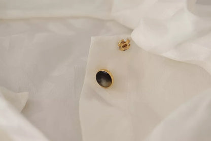 Dolce &amp; Gabbana – Blusentop aus Seide mit Ascot-Kragen in Weiß mit Muster