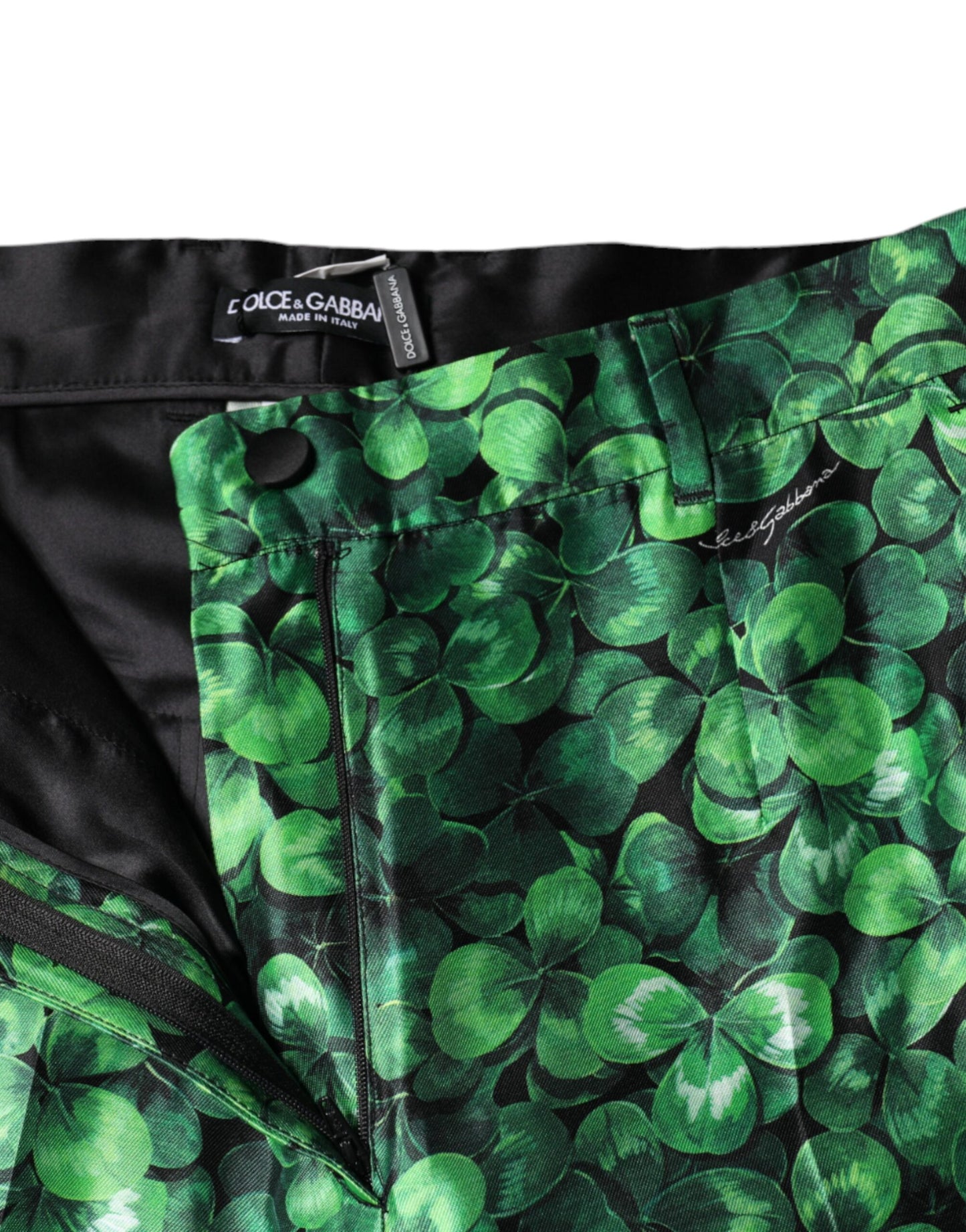 Dolce &amp; Gabbana – Hoch taillierte Karottenhose aus Seidensatin in Grün mit Kleeblatt-Print