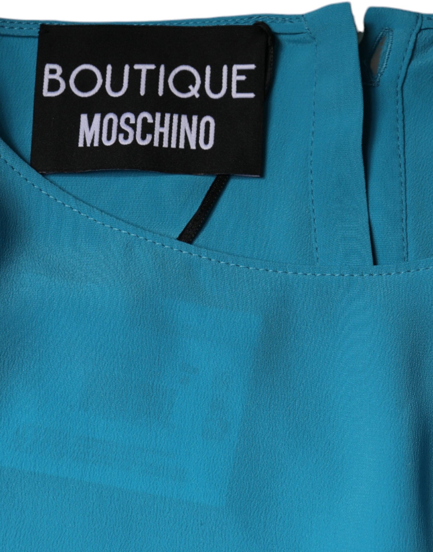 Boutique Moschino – Blaues Blusentop mit rundem Ausschnitt und langen Ärmeln
