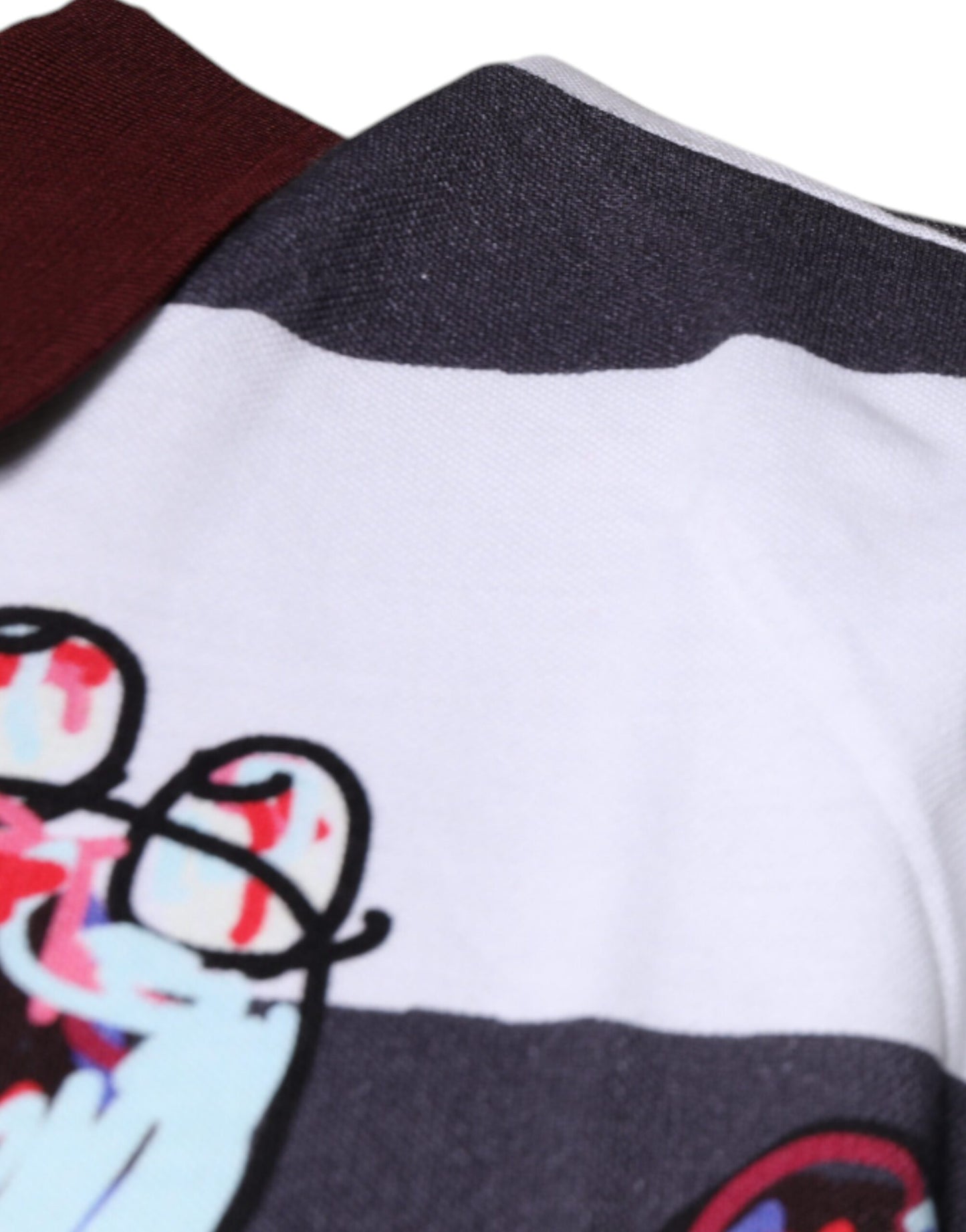 Dolce &amp; Gabbana – Poloshirt mit mehrfarbigem Grafikkragen