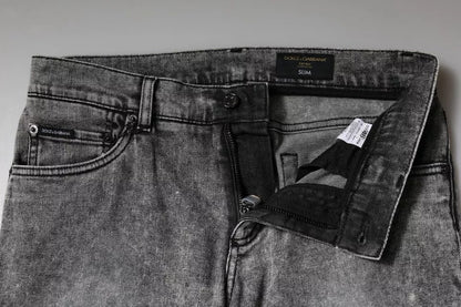 Dolce &amp; Gabbana – Slim Fit-Jeans aus Baumwolle mit Logo-Schild in Grau