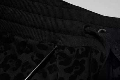 Dolce &amp; Gabbana – Jogginghose aus Baumwolle mit Leopardenmuster in Schwarz