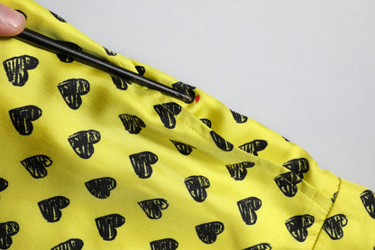 Dolce &amp; Gabbana – Grüne Bermudashorts aus Seide mit Herz-Print