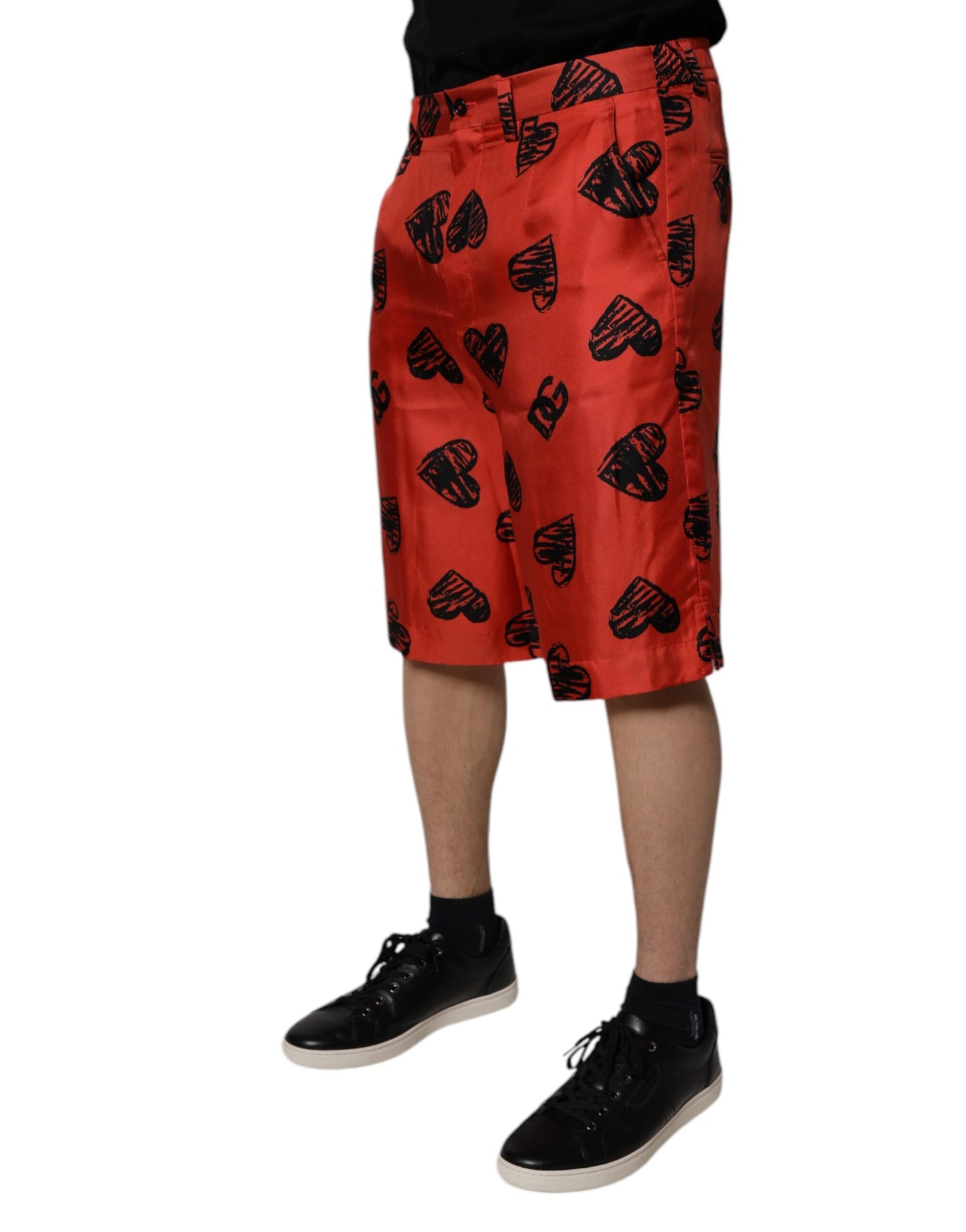 Dolce &amp; Gabbana – Orangefarbene Bermudashorts aus Seide mit Herz-Print