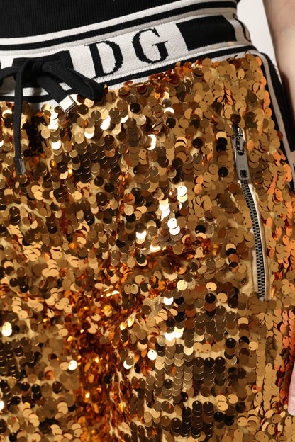 Dolce &amp; Gabbana – Jogginghose mit Pailletten und DG-Logo in Metallic-Gold