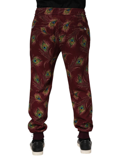 Dolce &amp; Gabbana – Jogginghose mit Pfauenfeder-Print in Burgunderrot