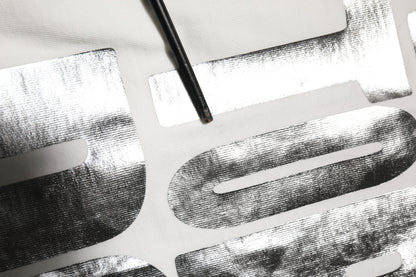 Dolce &amp; Gabbana – Weißes Baumwoll-T-Shirt mit Rundhalsausschnitt und Metallic-Print