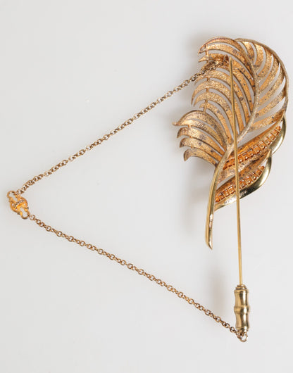Dolce &amp; Gabbana Goldfarbene Blattbrosche aus 925er Sterlingsilber mit Kristallkette