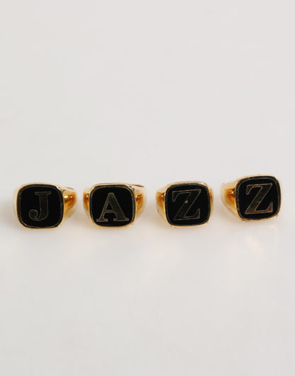 Dolce &amp; Gabbana – Goldfarbenes Messing-Buchstabenset „JAZZ“, 4-teilig, verstellbarer Ring
