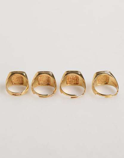 Dolce &amp; Gabbana – Goldfarbenes Messing-Buchstabenset „JAZZ“, 4-teilig, verstellbarer Ring