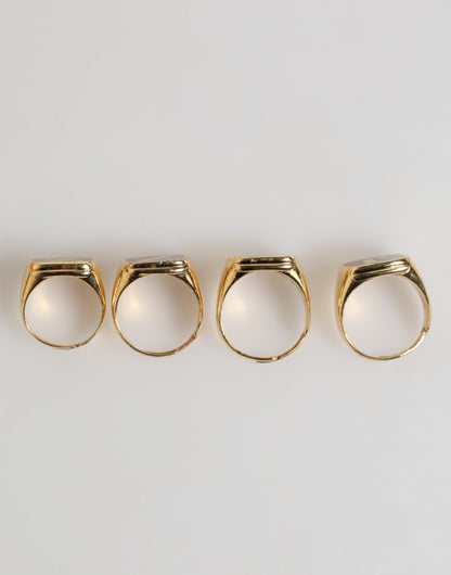 Dolce &amp; Gabbana – Goldfarbenes Messing-Buchstabenset „JAZZ“, 4-teilig, verstellbarer Ring