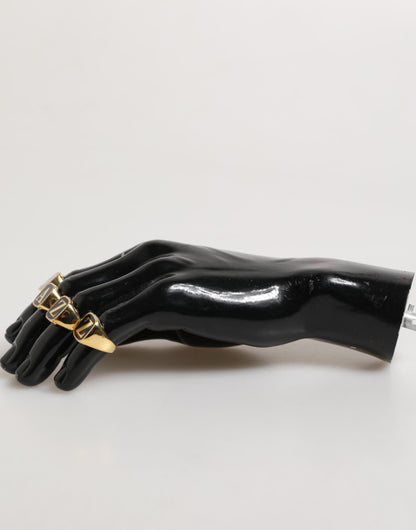 Dolce &amp; Gabbana – Goldfarbenes Messing-Buchstabenset „JAZZ“, 4-teilig, verstellbarer Ring