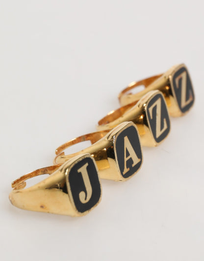 Dolce &amp; Gabbana – Goldfarbenes Messing-Buchstabenset „JAZZ“, 4-teilig, verstellbarer Ring