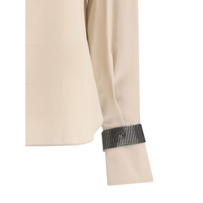 Brunello Cucinelli Seiden-Rollkragenbluse mit edlen Armbändern