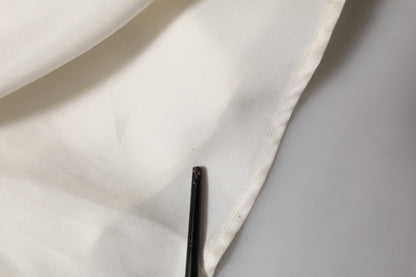 L'Autre entschied sich für ein ärmelloses Maxikleid aus Cupro-Viskose in Elfenbeinweiß