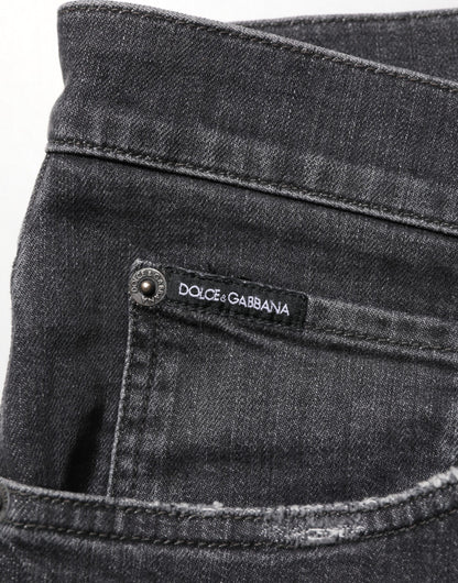 Dolce &amp; Gabbana – Slim Fit-Jeans aus schwarzer Baumwolle mit zerrissenem Logo
