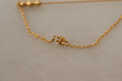 Dolce &amp; Gabbana – Goldfarbene Brosche aus 925er Sterlingsilber mit Kristallkette