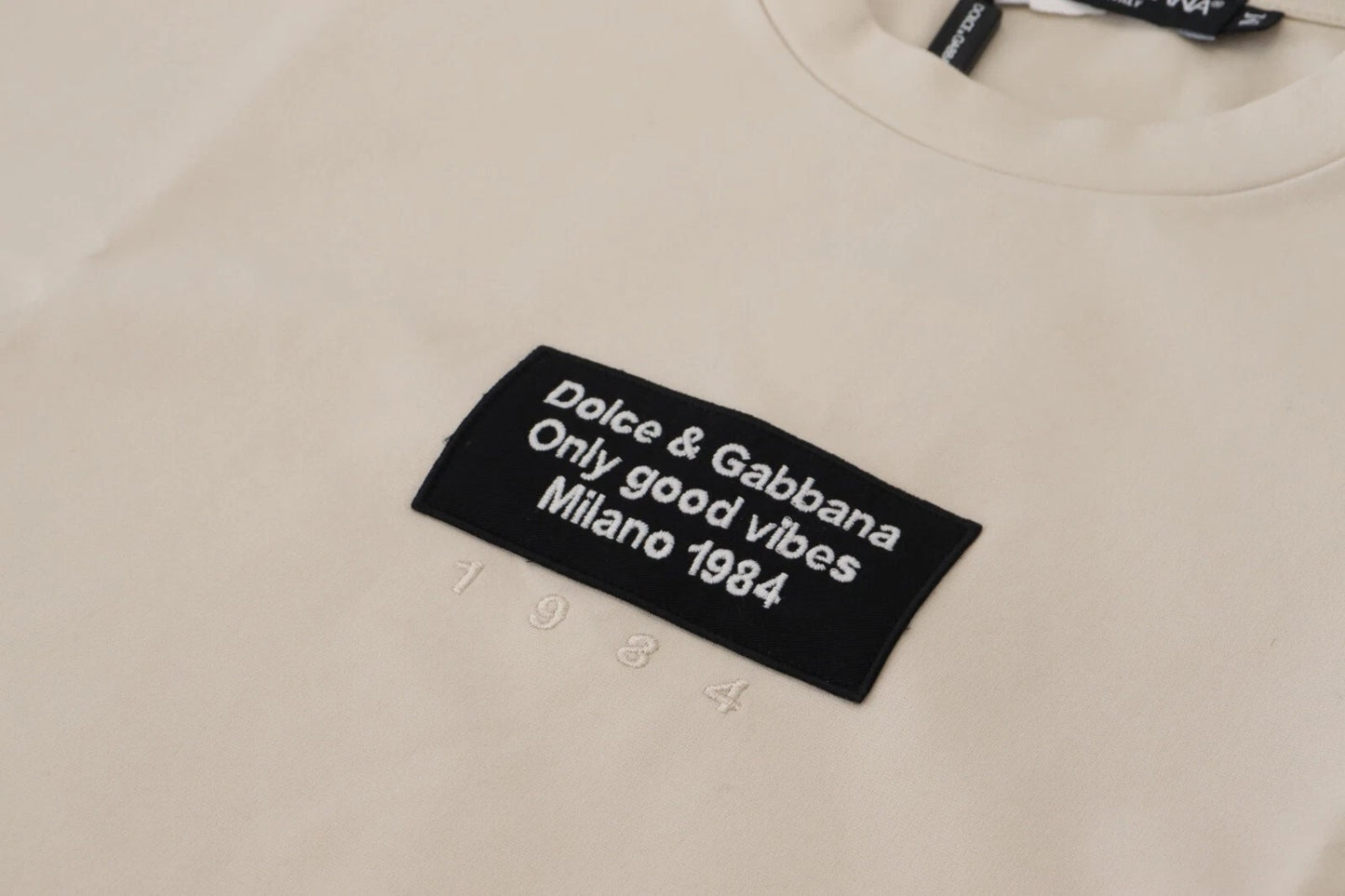 Dolce &amp; Gabbana Elfenbeinfarbener Rundhalsausschnitt aus Baumwolle mit Elfenbeindruck