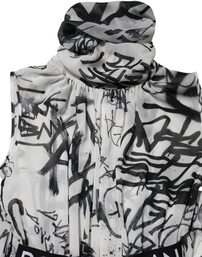 Dolce &amp; Gabbana – Langes, plissiertes Kleid mit Monogramm in Schwarz und Weiß