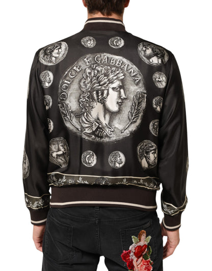 Dolce &amp; Gabbana – Schwarze Bomberjacke aus Seide mit „Monete“-Münzdruck
